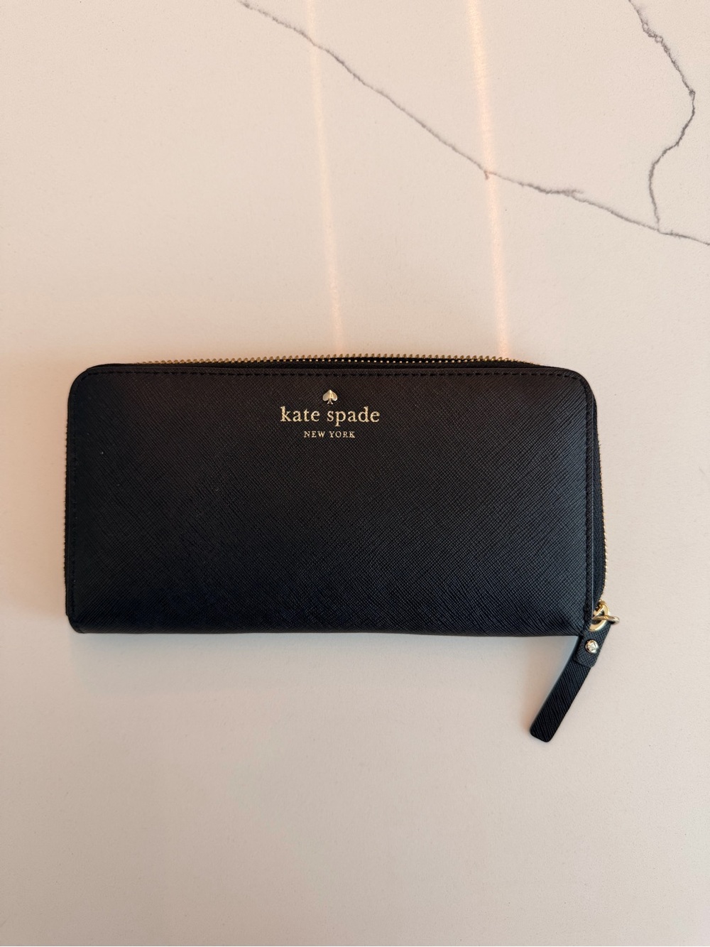 Kate Spade New York continental zip-around wallet with gold hardware